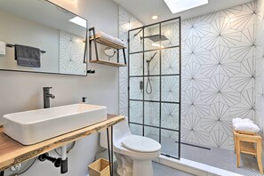 Guest bathroom with walk-in shower and live-edge custom sink
