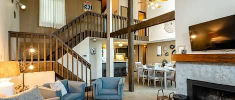 Living Room with high vaulted ceilings and fireplace