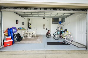 Our Garage Area With Bikes, Beach Chairs, Umbrellas, Dumbbells, & Coolers!