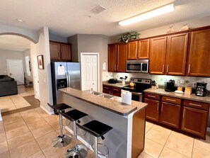 Open kitchen with breakfast counter