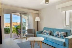 Airy living room with plush seating and balcony access (sea view is not guaranteed)