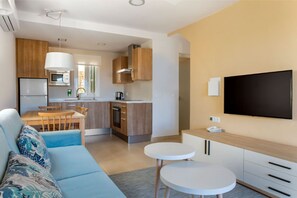 Open-plan living space with modern amenities and a comfortable dining area.