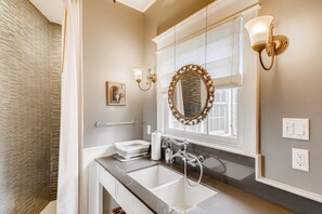 There's that sink! Also a spacious shower, toilet, and LG combination washer/drier