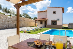 Have your breakfast by the pool, enjoying the views.