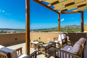 The balcony is equipped with patio furniture!