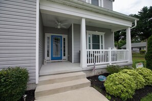 Front porch with comfortable chairs.