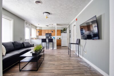 This expansive living space includes WIFI, TV, and a new sofa for kicking back and watching your favorite show or movie.