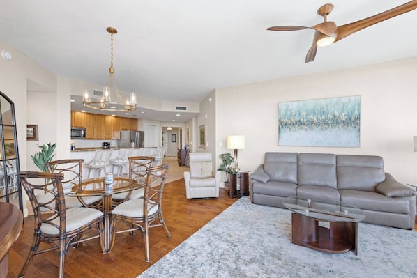 The huge windows provide beautiful natural light, and the dining table is perfect for sharing meals, catching up on work or homework, or playing a game or puzzle after dinner.