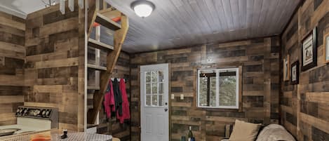 Relax in the cozy living room while preparing dinner in the galley kitchen