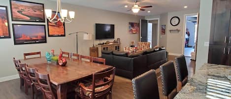 Main Living Area, Leather Couch, Large Smart TV, 5G & Dining Table, Nice Artwork