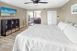 Master bedroom with King bed, ensuite bath, walk-in closet and access to the sunroom.