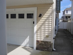 Garage door and walkway to your entrance door. - Garage door and walkway to your entrance door.