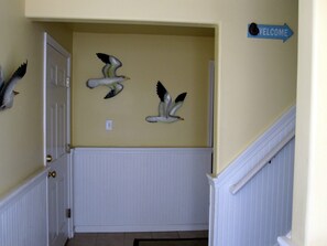 Ground floor Entrance way - please note the door to the left is to the garage and the stairwell to the right goes to your first floor vacation property.
