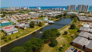 Aerial view of beach front with your condo building in the foreground