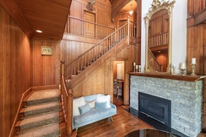 Historic triple height Foyer with Fireplace