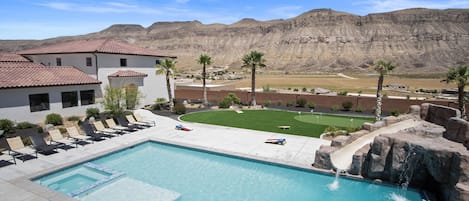 Large Swimming Pool With Slide and Jumping Rock