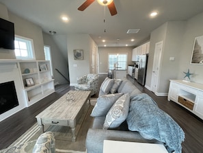 Open concept living area with living room, dining area, and kitchen