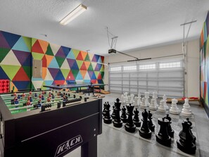 Game room with life-size chess, ping pong, and foosball