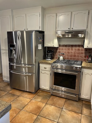 French door refrigerator and gas range