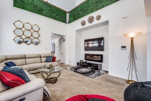 Feel relaxed on the bean bags or the reclining couch while watching TV.