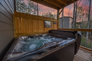 4 person hot tub with fold away spa cover holder.