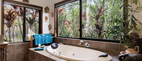 Enjoy a relaxing spa with bath salts provided and tropical views