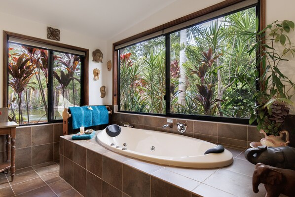 Enjoy a relaxing spa with bath salts provided and tropical views