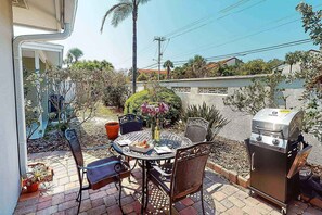 Outdoor patio with a BBQ propane grill.  Make new friends and have a cookout!