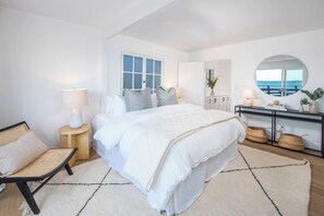 Upstairs Master with Cal King Bed and Smart TV. This bedroom steps onto top deck.