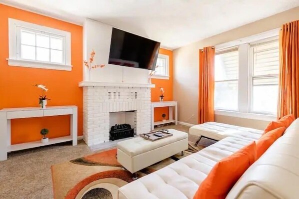 Living Room with Sofa Bed into King Bed, 50" Smart TV and Electric fire place.