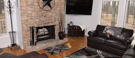 Living room with wood burning fireplace