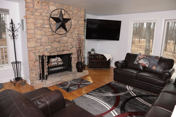 Living room with wood burning fireplace