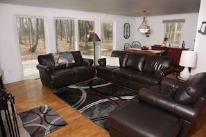 Open concept style kitchen, dining and living room