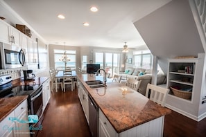 The main level features an open floor plan and a well-appointed kitchen
