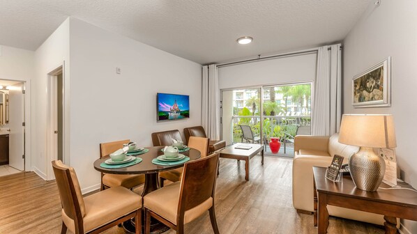 Charming and cozy living room with an amazing pool view area.