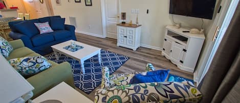 Common area with one queen sofa bed and one twin cot