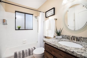 Clean bathroom stocked with all of the toiletries you'll need for your stay here!