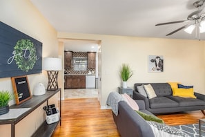 Living room is close to the kitchen. 