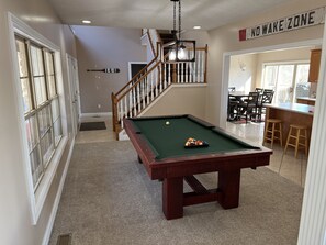 From the living room, looking into the front room and kitchen. 