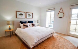 Generously sized Master Bedroom with a King bed, private ensuite, and walk-in robe—your personal sanctuary after a day of exploring.