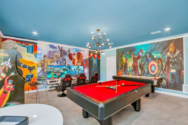 Game Room of the Home in Reunion Florida - From heroic decor to exciting game options - A space where everyone can unleash their inner superheroes  - Create lasting memories