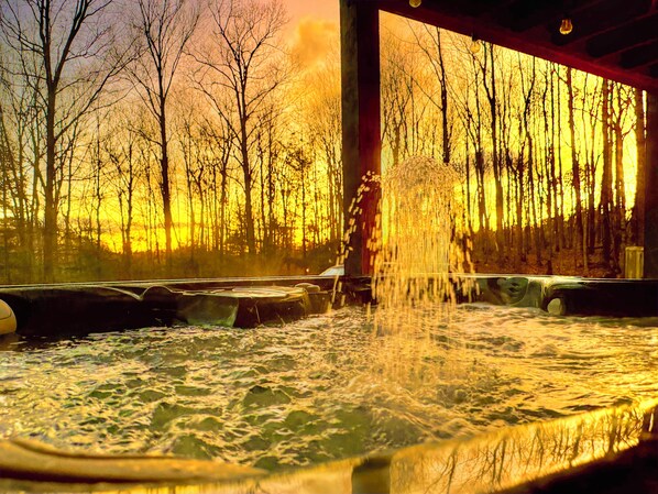 Sunrise in winter often brings bright colors, soak it in from a hot tub