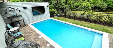 Private yard. Heated pool. 85”TV, ice maker, refrig.