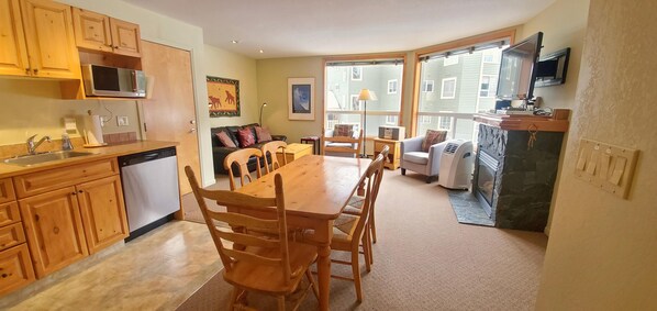 Open plan kitchen, dining, and living