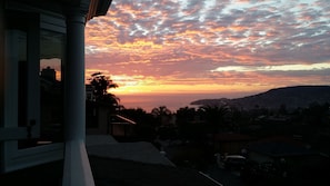 View of a Sunset over the Pacific Ocean from the master bedroom private deck