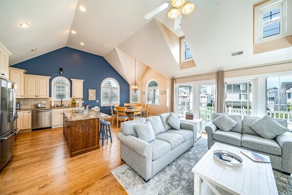 Open living room area with high ceilings
