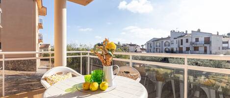 Sky, Table, Building, Plant, Furniture, Property, Flower, Chair, Flowerpot, Cloud