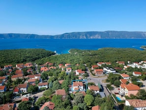 Sky, Water, Building, Nature, Azure, Tree, Mountain, Natural Landscape, Coastal And Oceanic Landforms, Urban Design