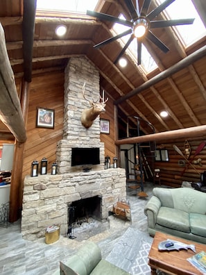 Large true fireplace is the focal point of this rustic true log cabin!!