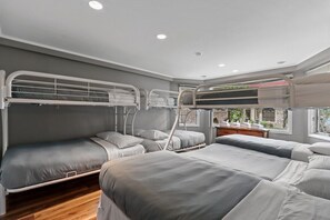 Main Floor Bunk Room with 3 bunk beds, twins over fulls.
2 twin beds